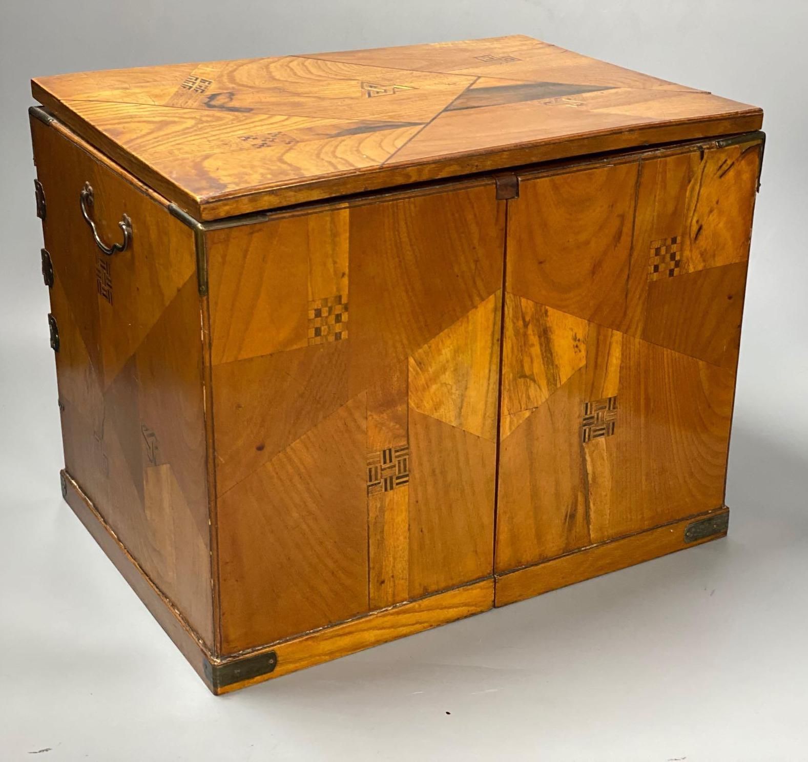 A Japanese metal mounted inlaid elm box with drawers, length 36cm